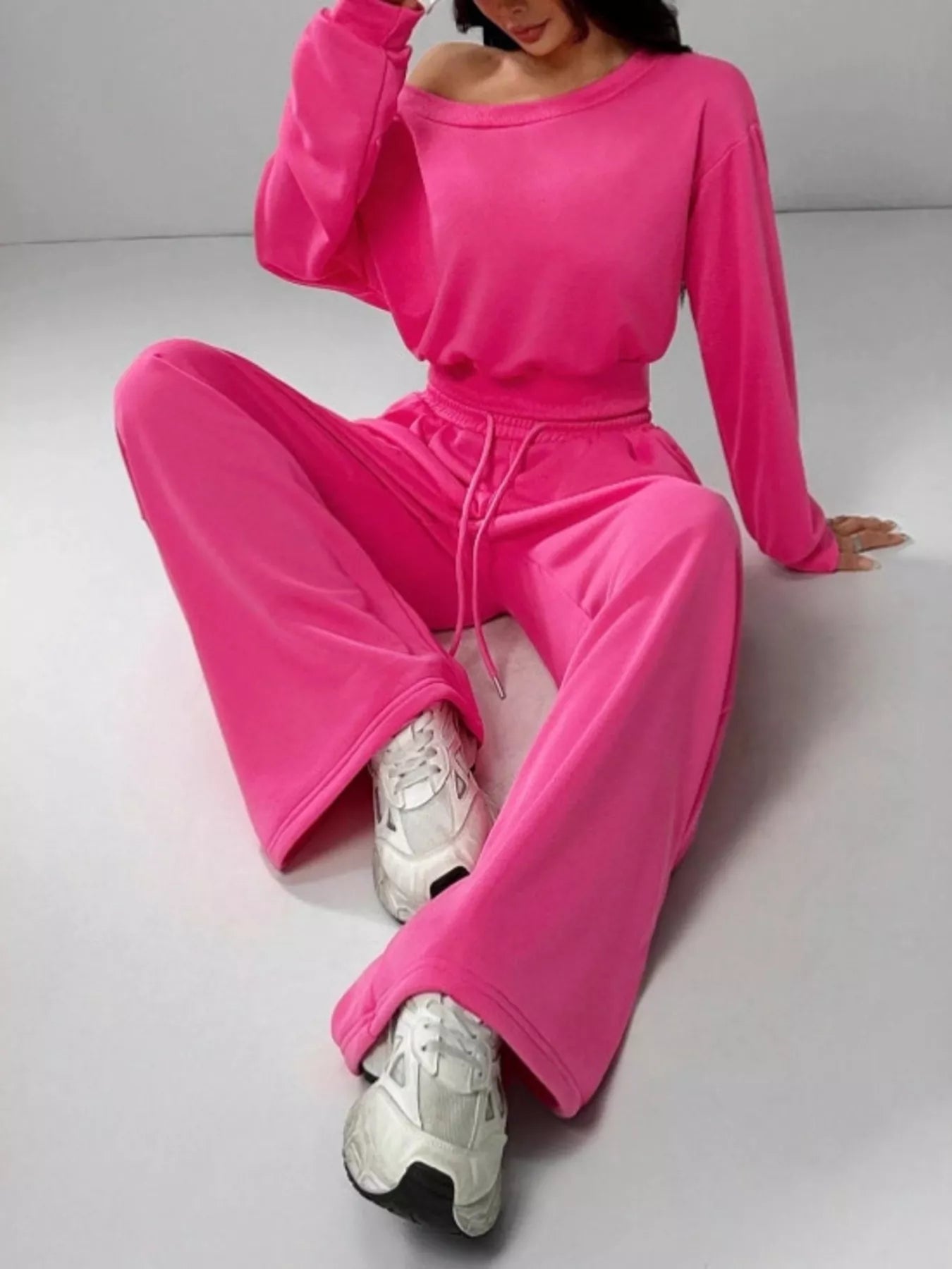 Bright pink velour boat neck long sleeve top and drawstring pants set