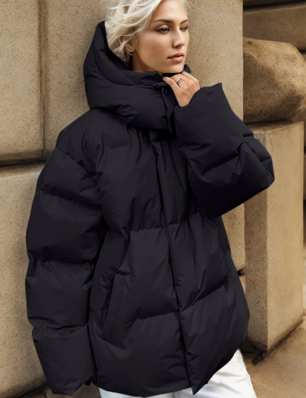 Black pocketed zip-up hooded puffer jacket with quilted design