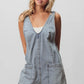BiBi Patch vintage washed denim shortall with v-neckline and front pockets
