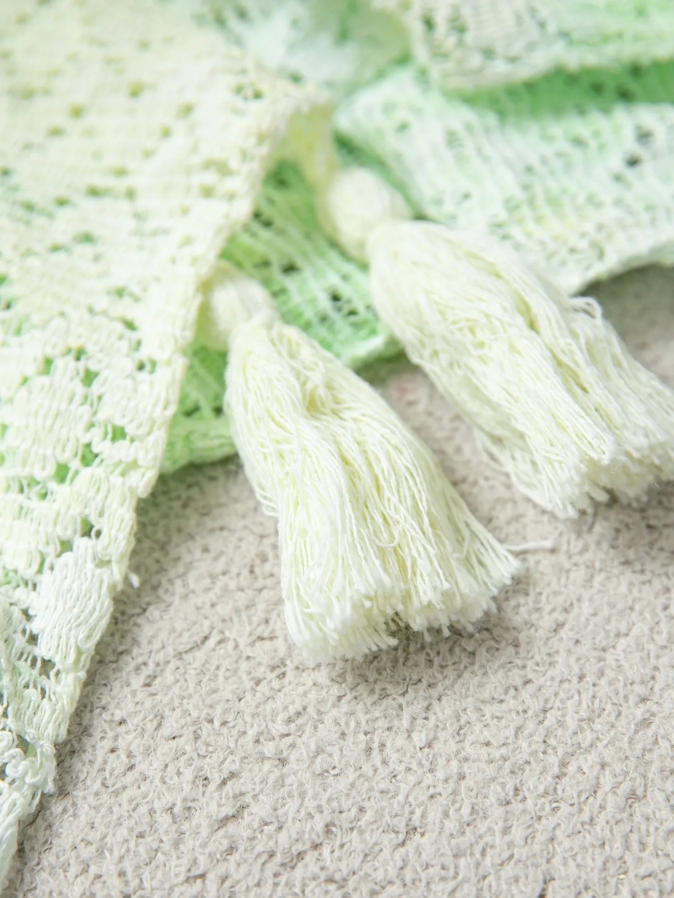 Daverri openwork tassel gradient knit cover-up in off-white crochet with green mesh