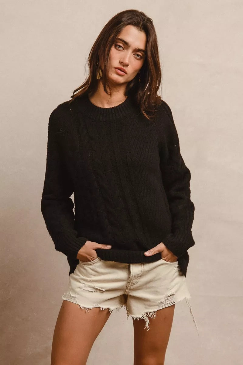 Black oversized cable-knit BiBi Twist sweater with relaxed fit