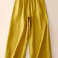 Daverri wide-leg button-decorated pants in golden-yellow flowing fabric