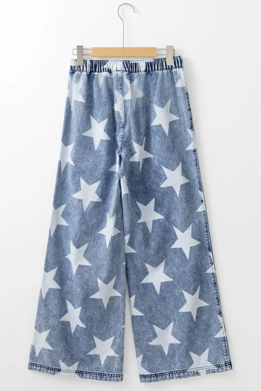Blue denim high-waist wide-leg jeans with white star print