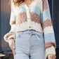 Cozy color block button-up cardigan in cream, blue, and pink stripes