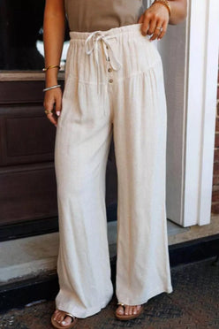 Cream-colored wide-leg drawstring pants with button details