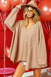 Cozy camel waffle-knit oversized BiBi V-neck sweater with uneven hem