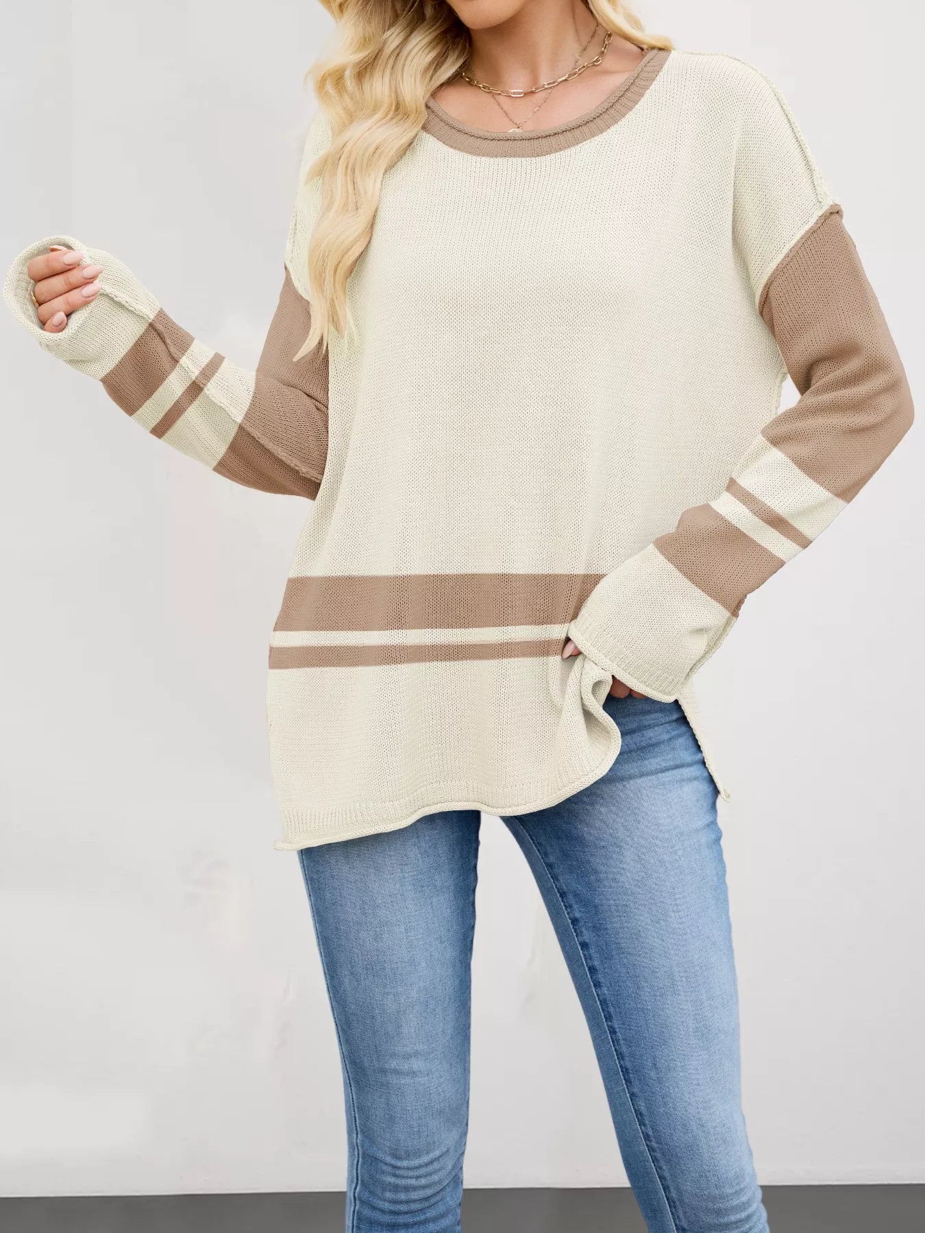 Cream-colored Color Block Side Slit Sweater with striped accents