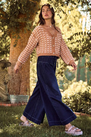 Navy blue wide-leg corduroy pants with drawstring waist and white stitching