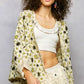 Cream-colored POL open-front crochet cardigan with green-black floral pattern