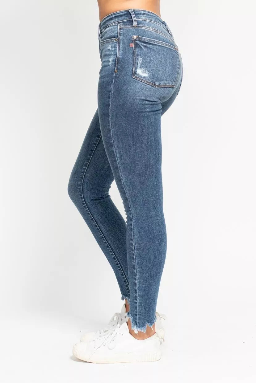 Judy Blue high-waisted skinny jeans in faded blue wash with frayed hem
