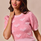 Pink fuzzy SO ME cropped sweater with heart motifs and puffy sleeves