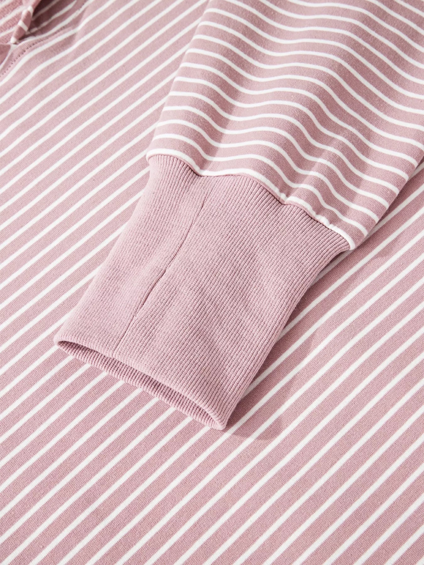 Dusty pink striped thumbhole hoodie with side slits and drop shoulders