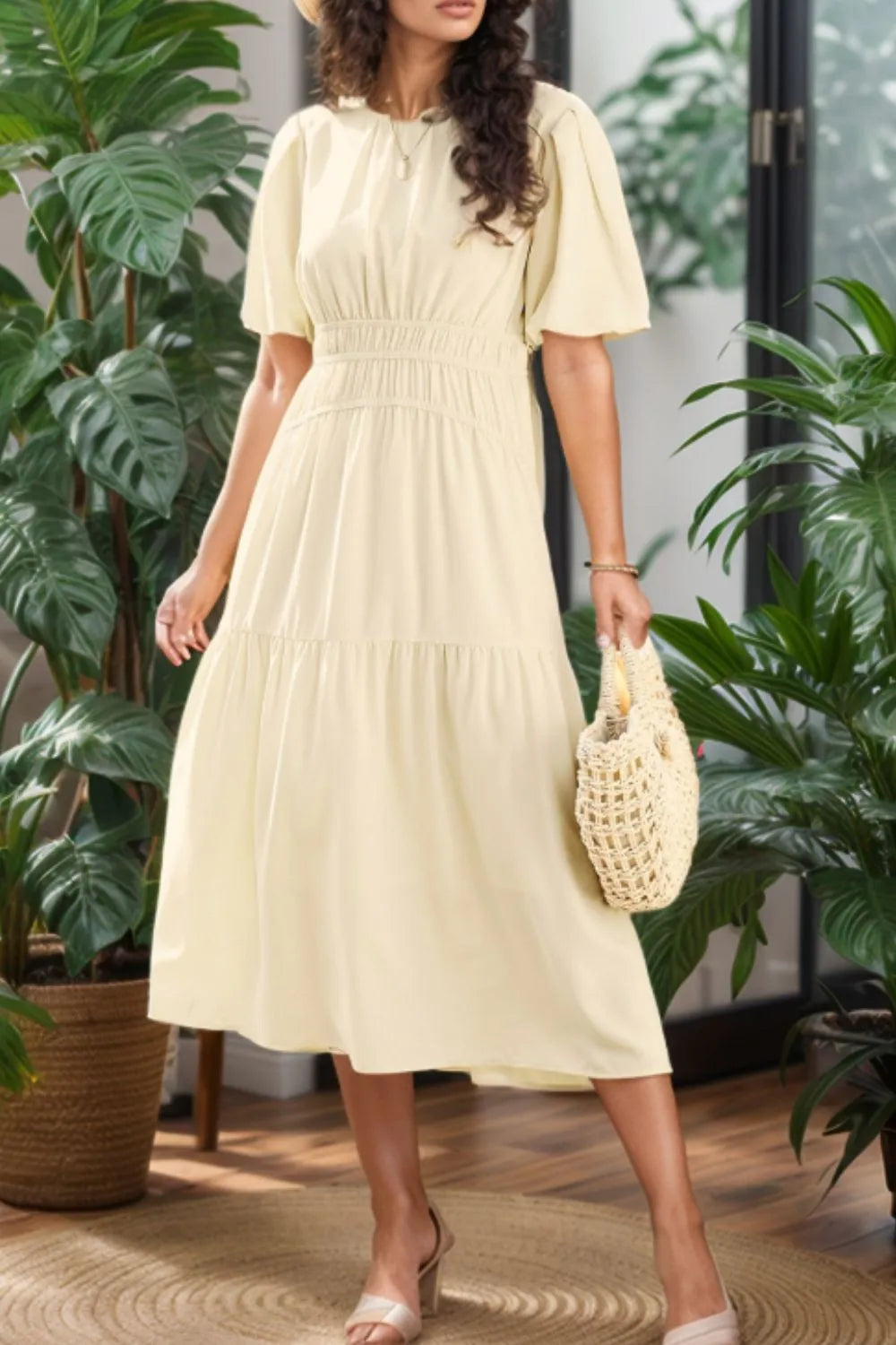 Cream puff sleeve tiered midi dress with ruffled neckline and straw bag