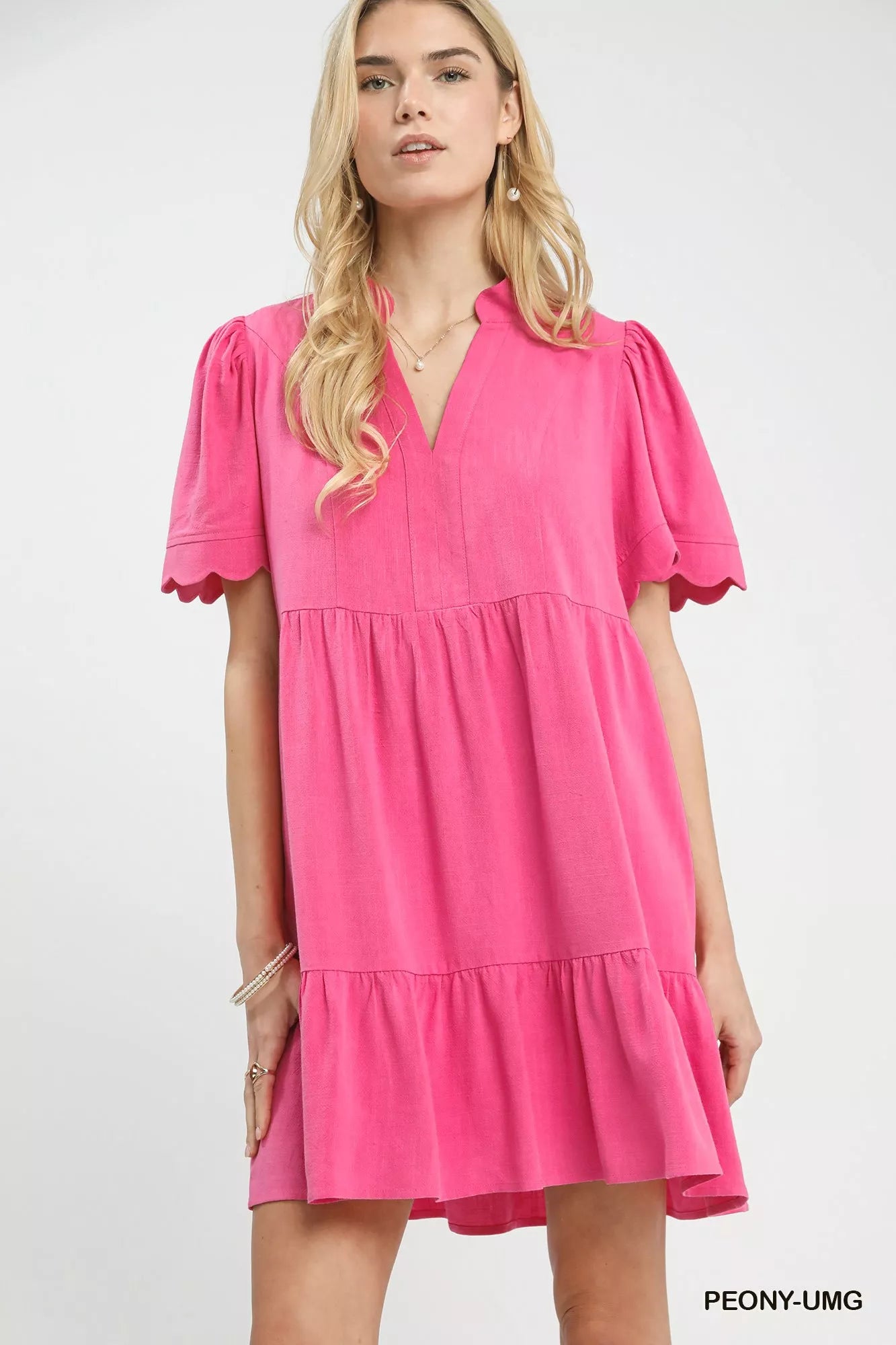Umgee linen tiered babydoll dress in vibrant pink with scalloped puffy sleeves