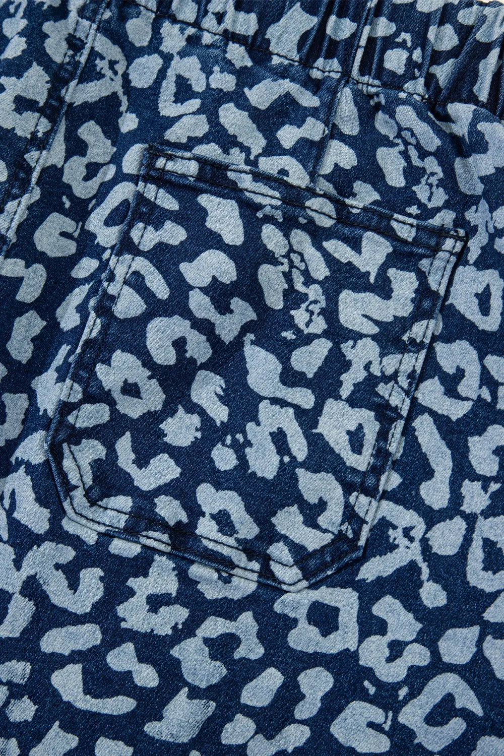 Leopard print wide leg jeans with white spots on blue background