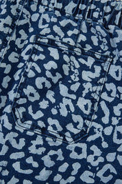 Leopard print wide leg jeans with white spots on blue background