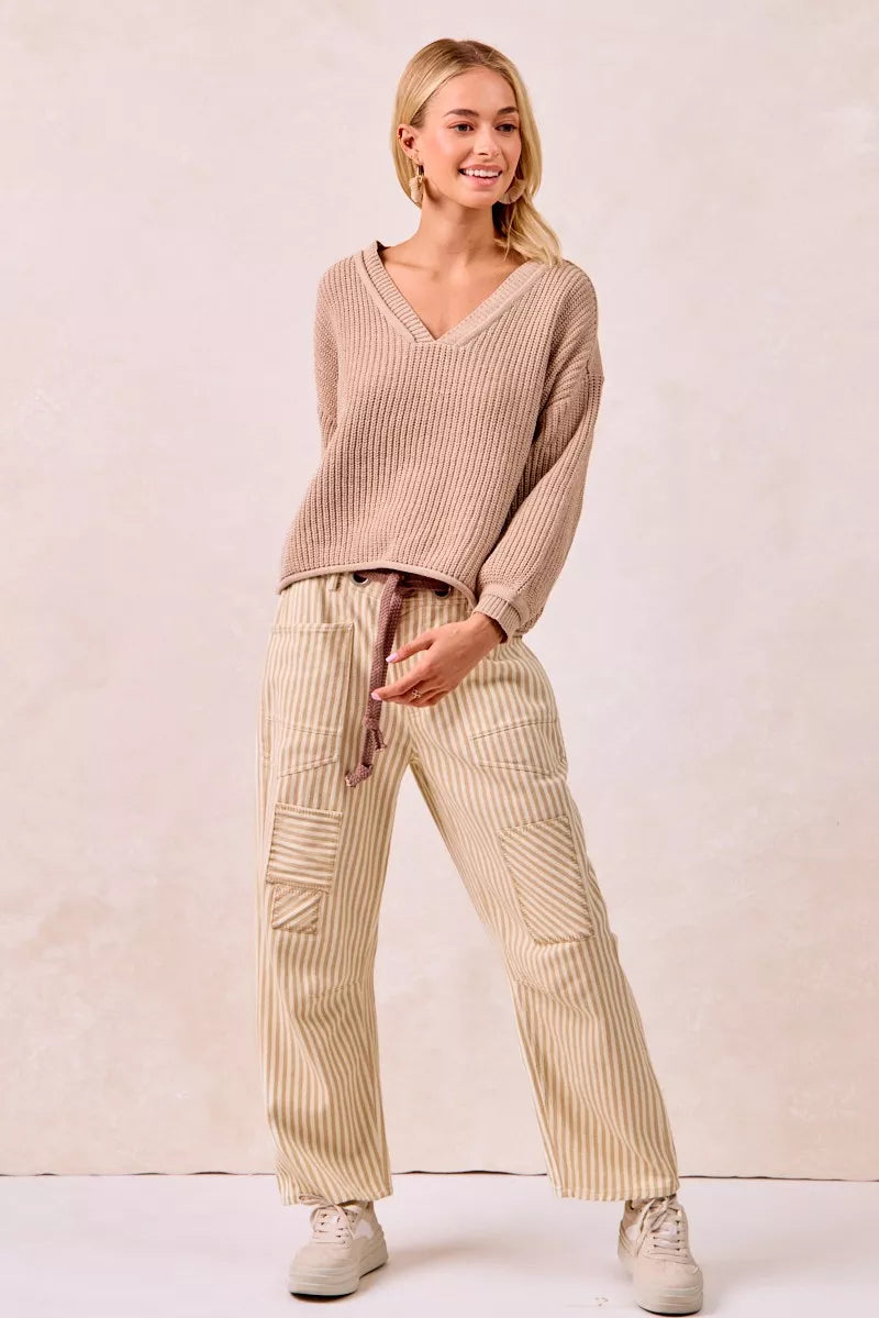 Beige ribbed knit v-neck sweater with BiBi drawstring striped pants