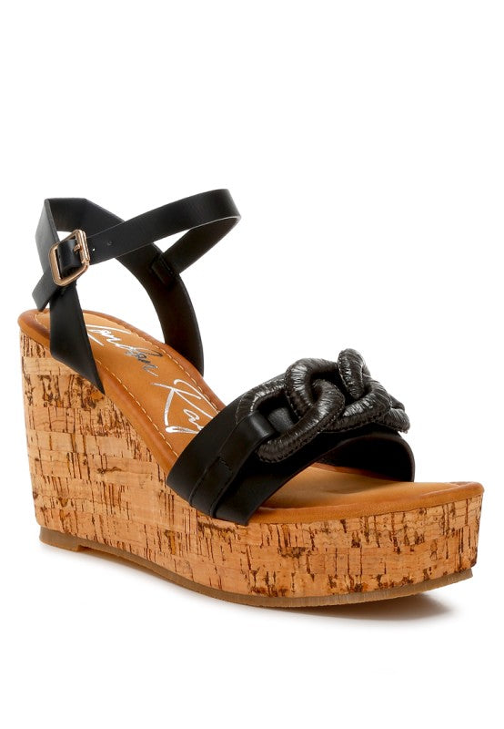 Black leather Emelda wedge sandal with cork platform and chain strap