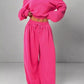 Vibrant pink boat neck cropped sweatshirt and wide-leg joggers set