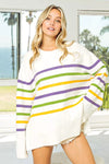 Cozy oversized BiBi Ribbed Hem Mardi Gras striped sweater in white with purple, green, yellow stripes