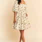 Woman in Davi & Dani cactus print poplin mini dress with puff sleeves