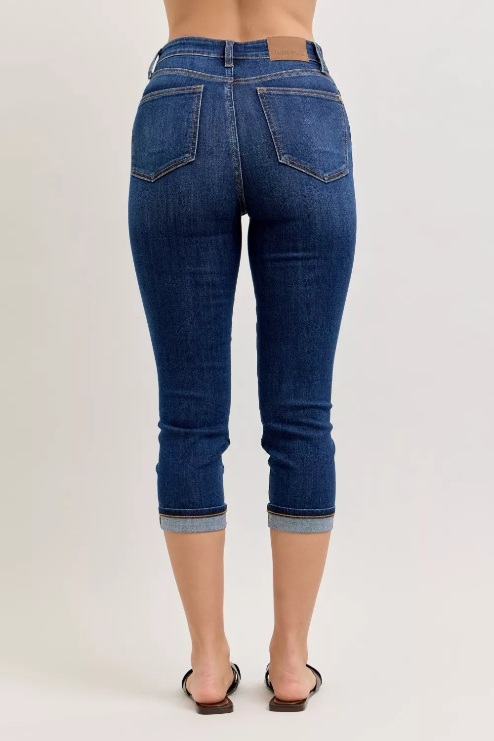Judy Blue high waist dark blue denim capri jeans with rolled cuffs and brown leather patch