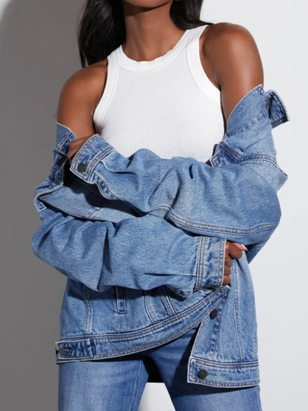 Daverri button-up collared blue denim jacket with off-shoulder sleeves