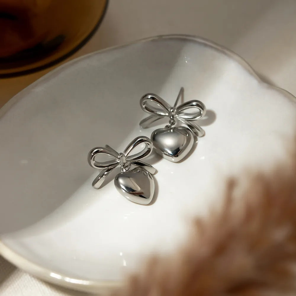 Stainless Steel Bow & Heart Drop Earrings | Earrings Daverri Fashions