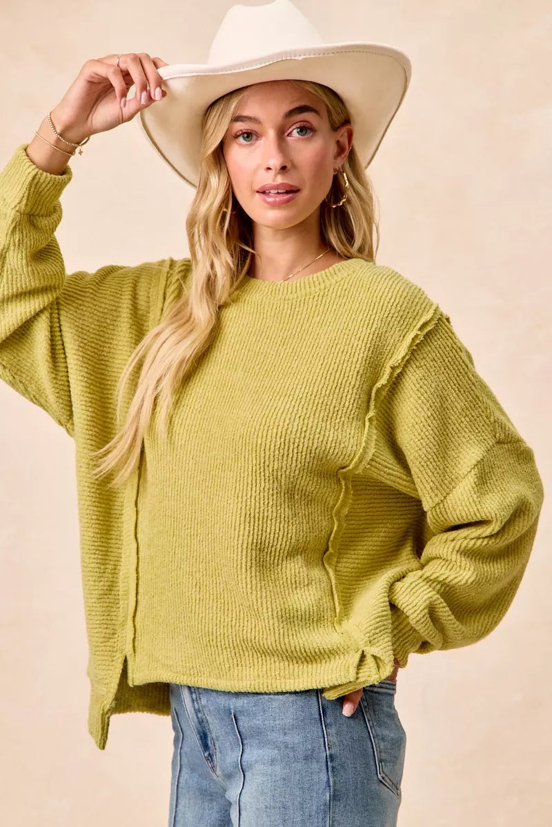 Cozy olive-green BiBi Boucle rib knit sweater with ruffled sleeves