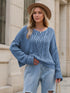 Soft blue chunky knit cable sweater with round neck and dropped shoulders