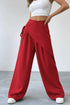 Daverri Wrap-Front Wide-Leg Pants in red with draped asymmetrical design and side tie