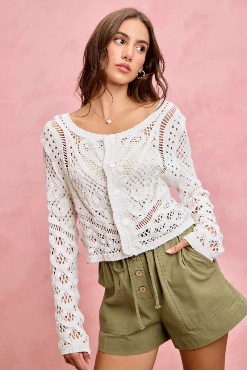 White crochet cardigan with lace patterns on twill shorts