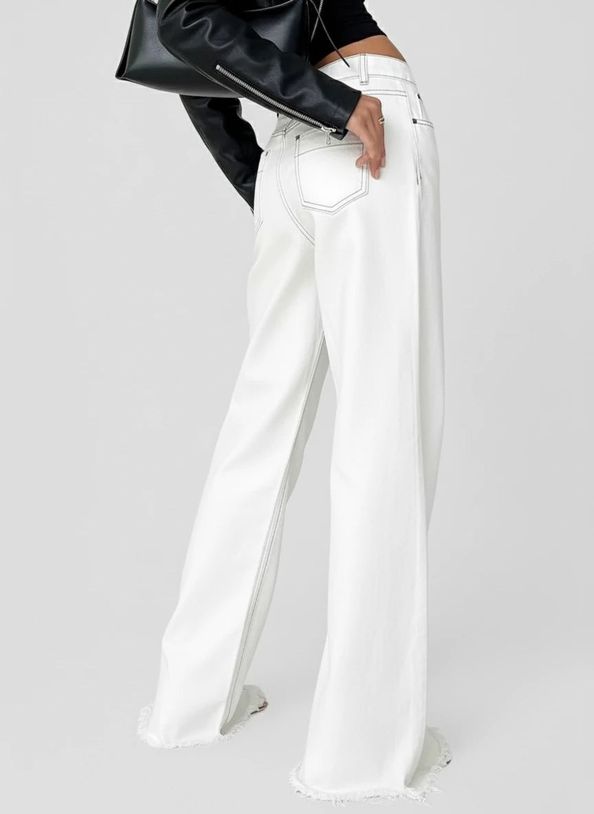 White high-waisted wide-leg jeans with relaxed fit and button fly