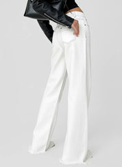 White high-waisted wide-leg jeans with relaxed fit and button fly