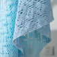 Delicate light blue Daverri openwork tassel gradient crochet shawl
