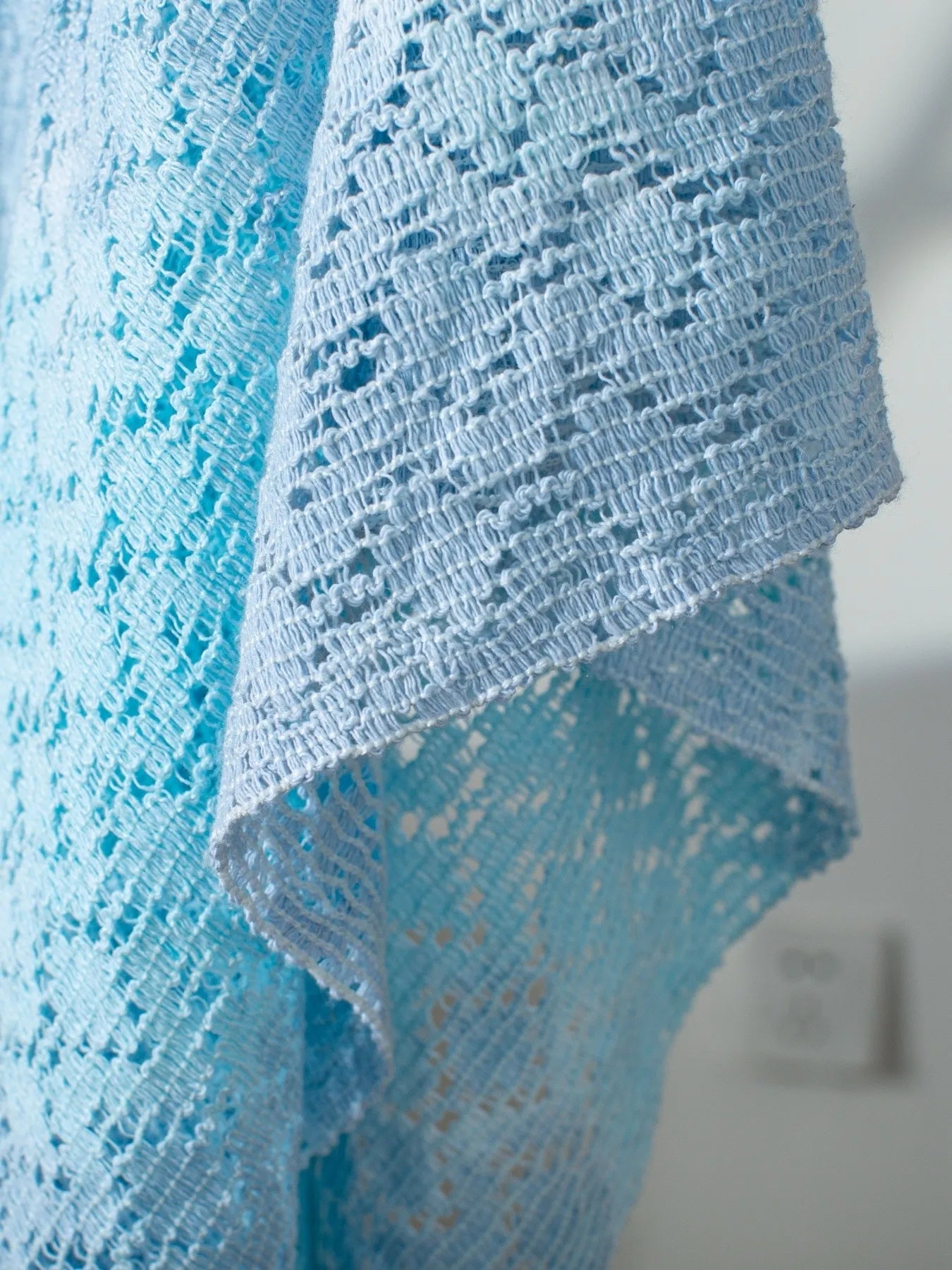 Delicate light blue Daverri openwork tassel gradient crochet shawl