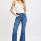 RISEN mid rise flare jeans in blue denim with frayed hem