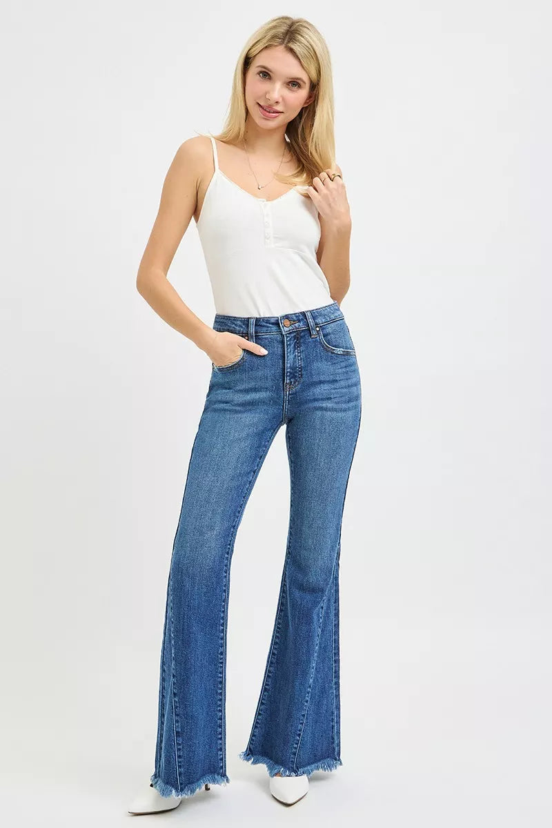 RISEN mid rise flare jeans in blue denim with frayed hem