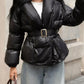 Daverri Long Sleeve Belted Puffer Jacket in black with shiny quilted exterior and gold buckle