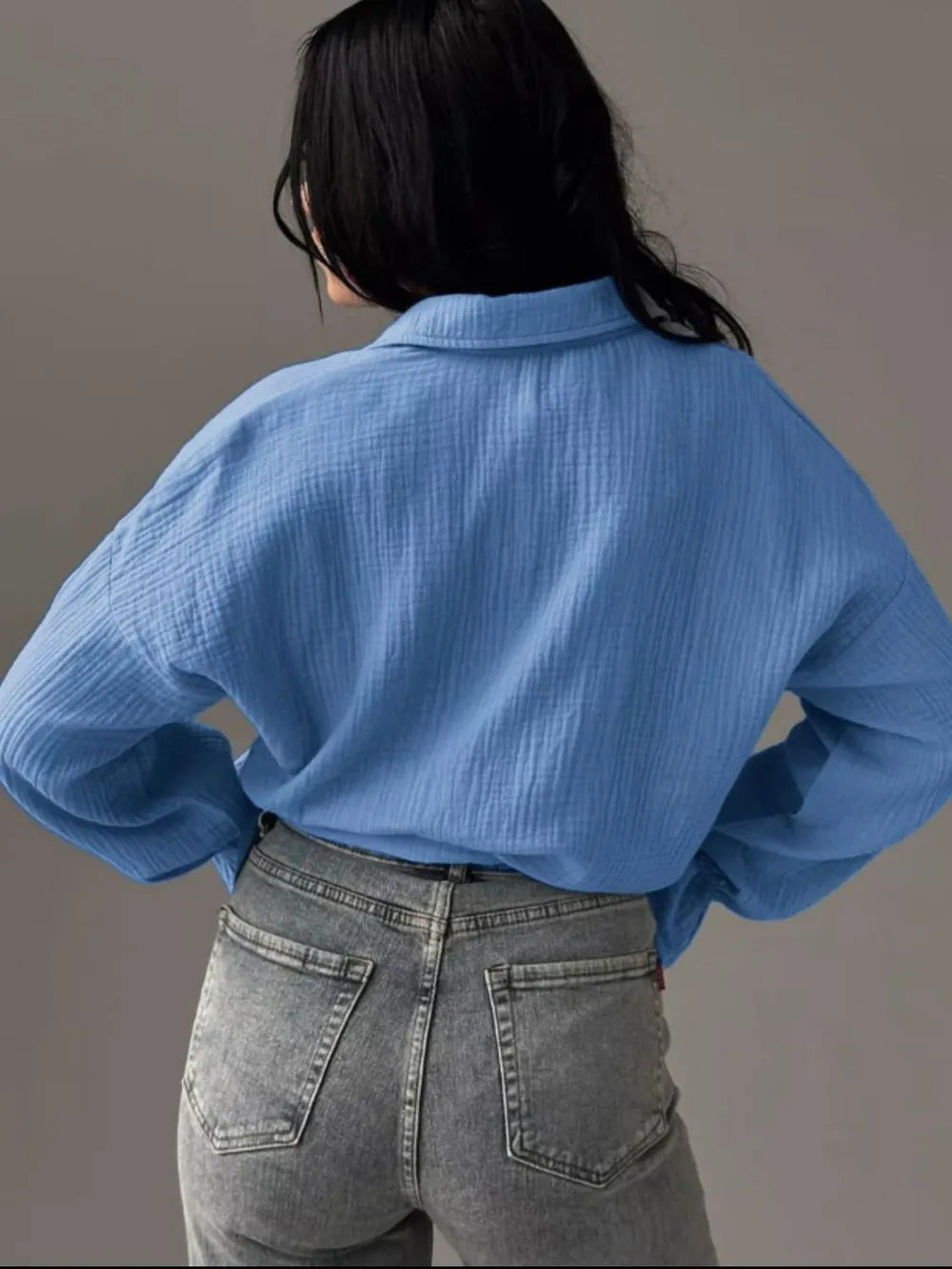 Light blue textured cotton blouse with collared flounce sleeves