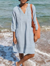 Light blue textured linen V-neck mini dress with 3/4 tied sleeves