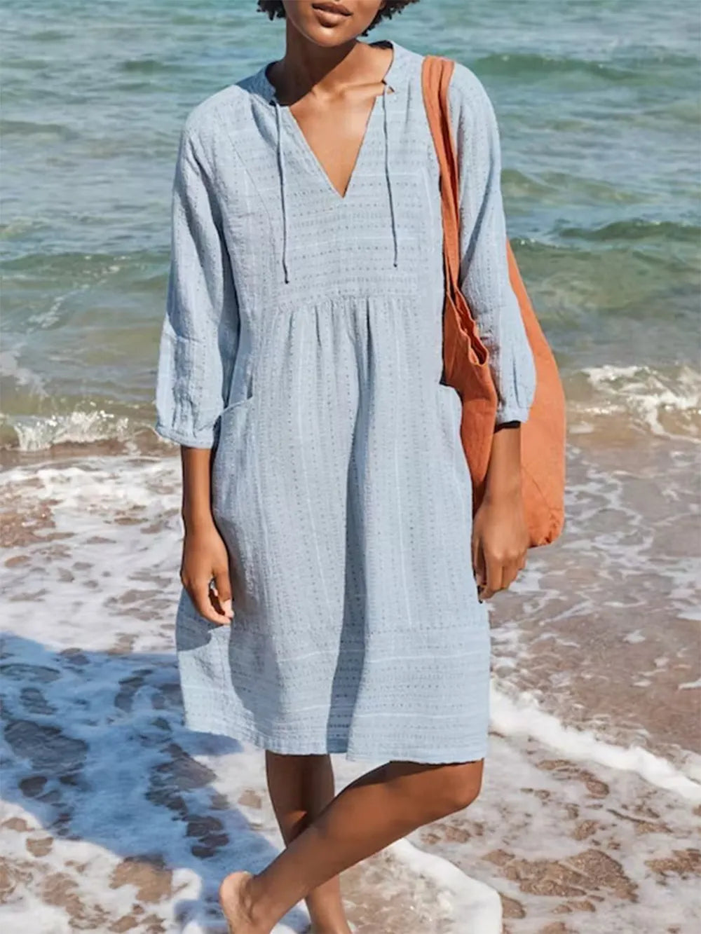 Light blue textured linen V-neck mini dress with 3/4 tied sleeves