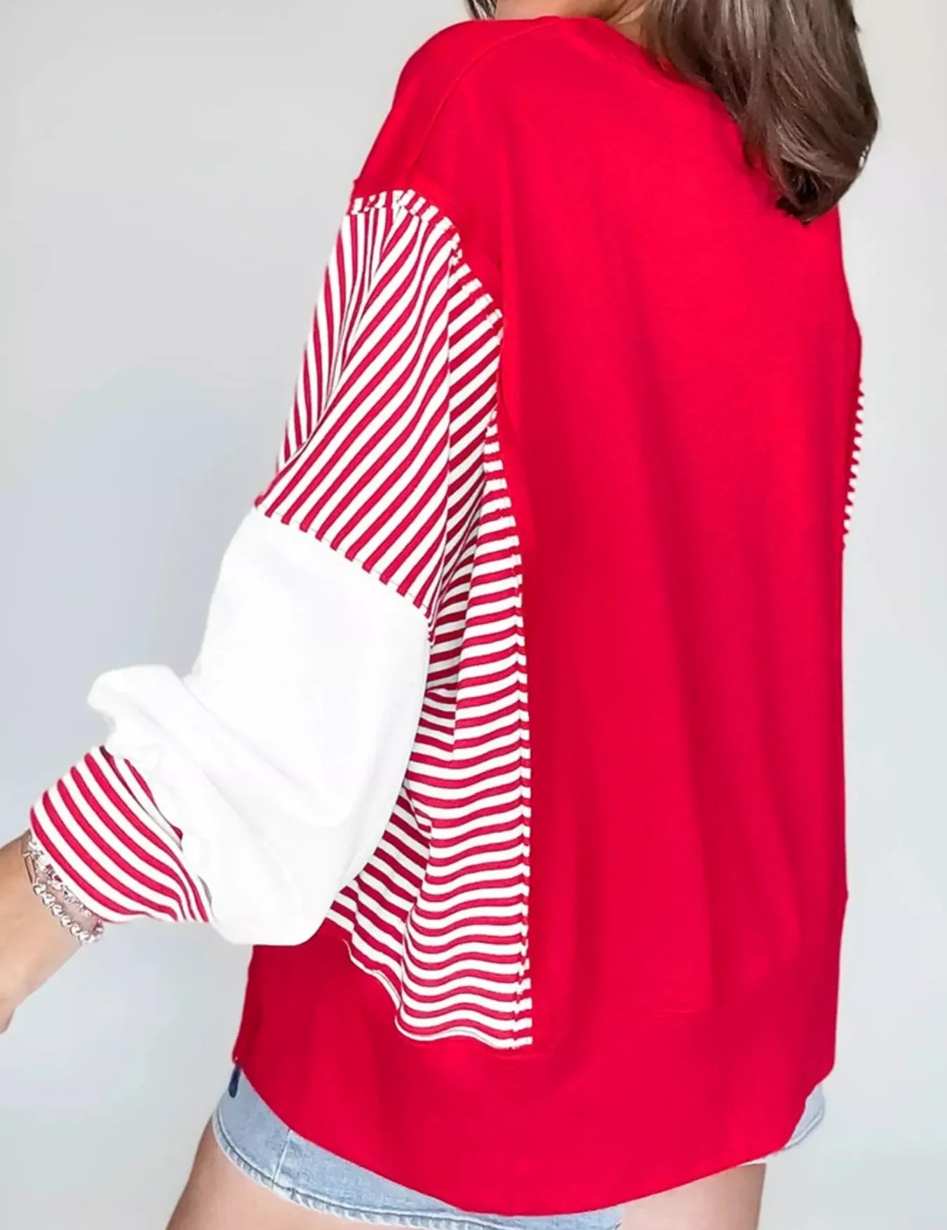 Red and white striped patchwork sweatshirt with textured sleeves