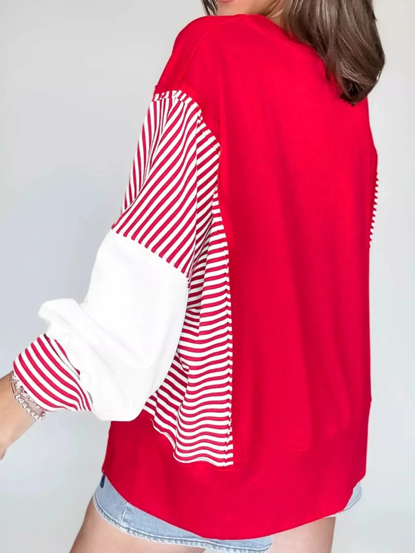 Red and white striped patchwork sweatshirt with textured sleeves