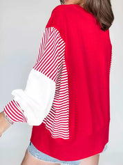 Red and white striped patchwork sweatshirt with textured sleeves