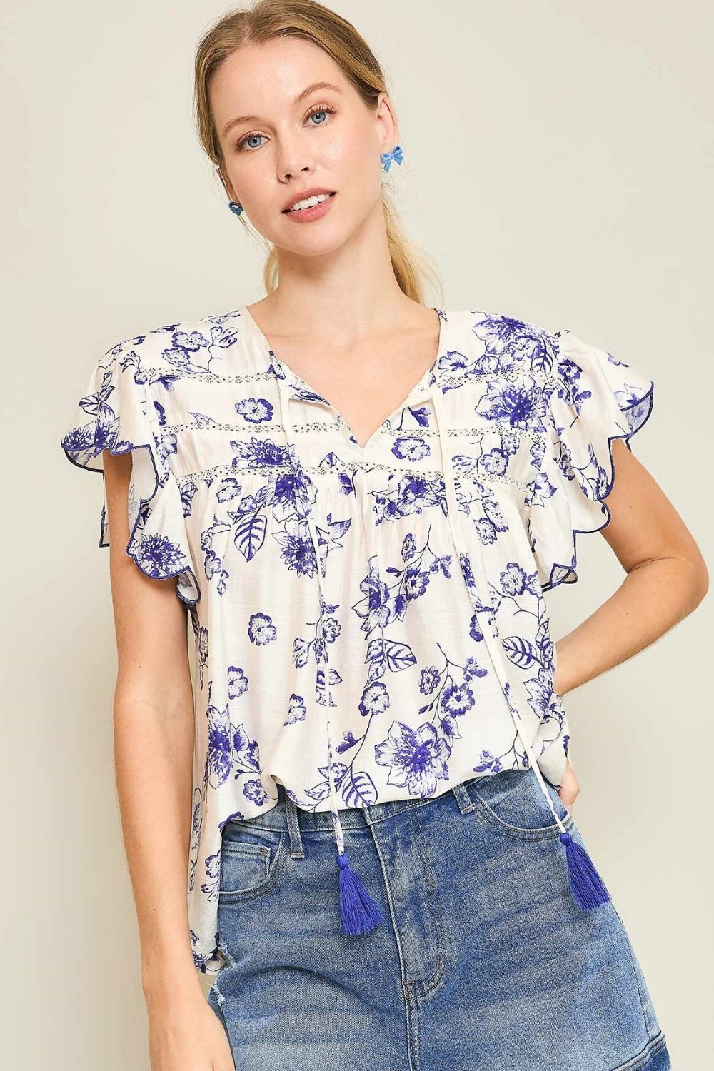 Umgee Full Size Floral Print Tassel Tie Neck Scalloped Sleeve Blouse Plus Size Royal Blue Blouses