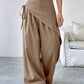 Daverri wrap-front wide-leg pants in beige with draped asymmetrical design