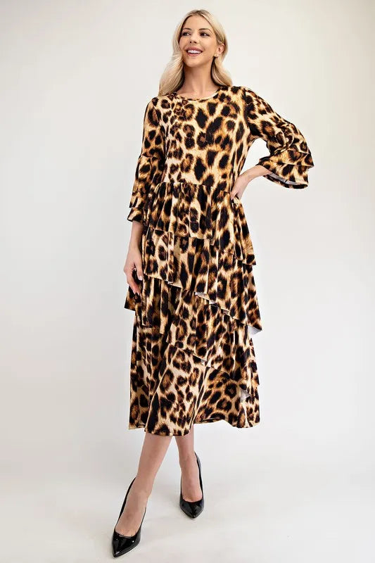 Woman wearing a leopard print dress on a white background