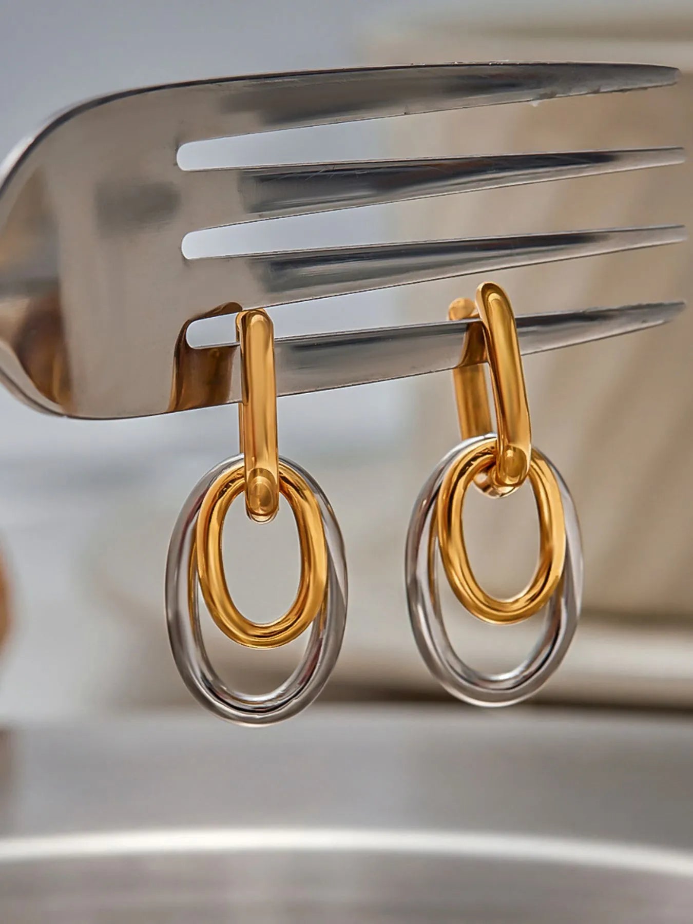 Stainless Steel Two-Tone Interlocked Hoop Earrings | Earrings Daverri Fashions
