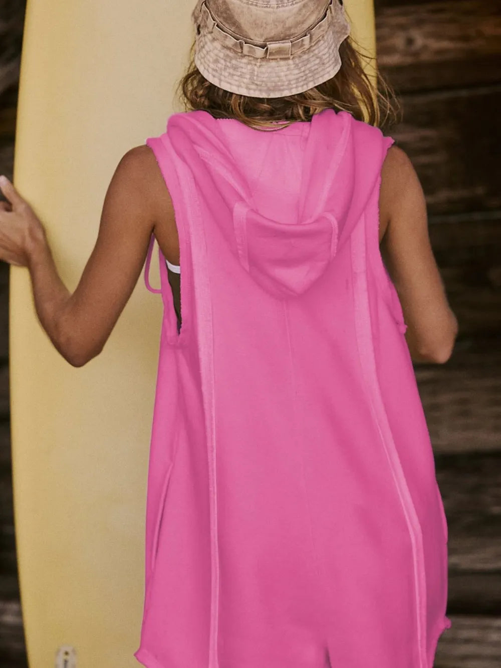 Vibrant pink half-zipped hooded sleeveless romper cover-up back view